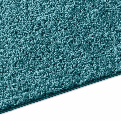 Hoogpolig vloerkleed effen Spectrum - turquoise - close up zijkant, thumbnail