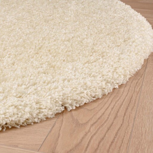 Rond hoogpolig vloerkleed shaggy Grand effen - crème - close up zijkant, thumbnail