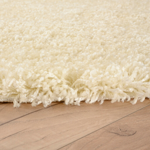 Rond hoogpolig vloerkleed shaggy Grand effen - crème - close up zijkant, thumbnail