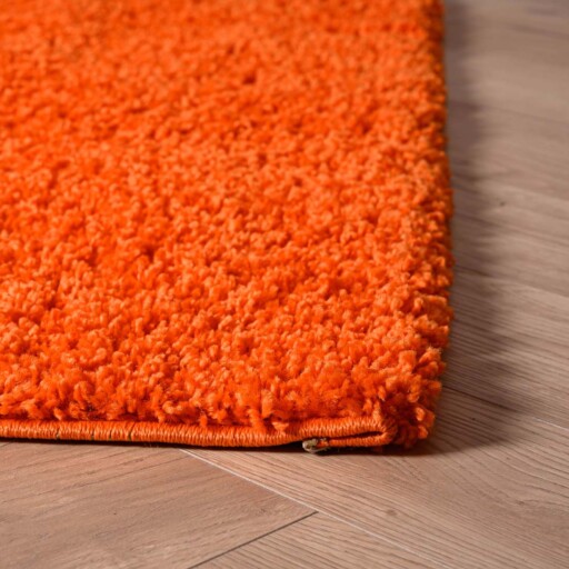 Hoogpolig vloerkleed shaggy Trend effen - oranje - close up hoek, thumbnail