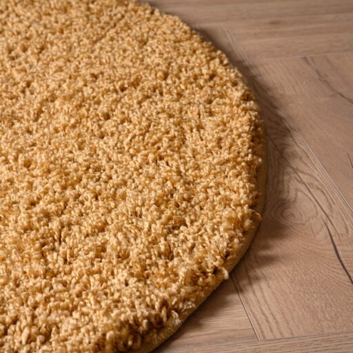 Rond hoogpolig vloerkleed shaggy Trend effen - goud - close up zijkant, thumbnail