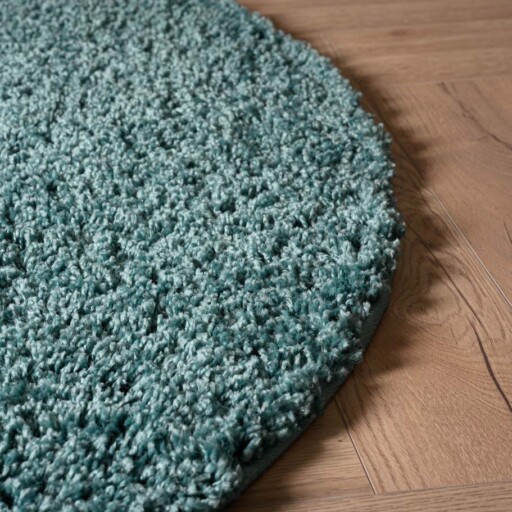 Rond hoogpolig vloerkleed shaggy Trend effen - lichtblauw - close up zijkant, thumbnail